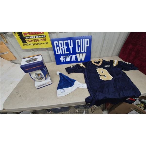 Grey Cup #FOR THE W Sign, Winnipeg Blue Bombers #9 Jersey, and Santa Hat