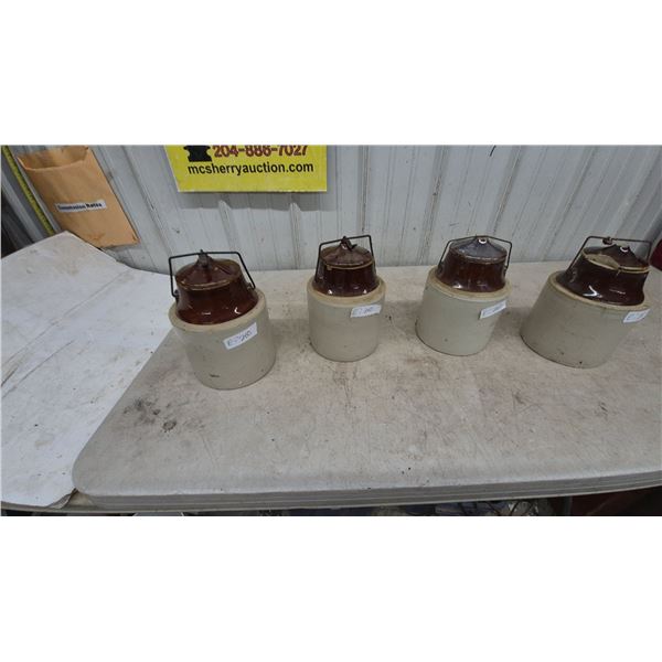 Four Stoneware Crocks with Brown Glazed Lids and Wire Bails