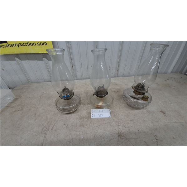 Three Oil Lamps: Two Clear Glass and One Cut Glass Base, All with Clear Glass Chimneys
