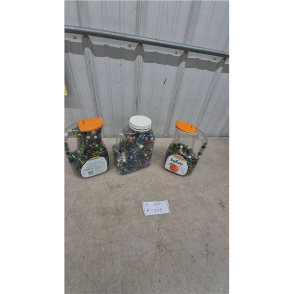 Three Containers of Marbles, including Tropicana and White Cap Containers