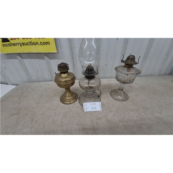 Three Oil Lamps: Brass Base Lamp, Clear Glass Lamp one with Chimney, and Clear Glass Lamp