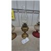 Image 4 : Three Oil Lamps: 1 Brass Base and Clear Glass Font, 1 Brass Base and Clear Glass Font, 1 Red Base.