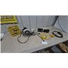 Image 1 : Skilsaw 7-1/4” Circular Saw, Powermate Cord Reel, and Assorted Power Cords and Timers