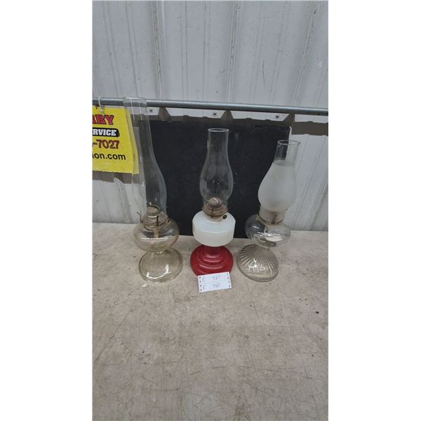 Three Oil Lamps: Clear Glass, Red and White Glass, and Frosted Glass