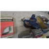 Image 5 : Bench Vise, 7” Value Pack Bonnets, Studsensor, 15-Piece Wood Spade Bit Set, and More chain saw