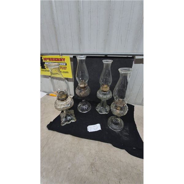 4 Clear Glass Oil Lamps with Chimneys and Brass Burners.