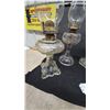Image 9 : 4 Clear Glass Oil Lamps with Chimneys and Brass Burners.