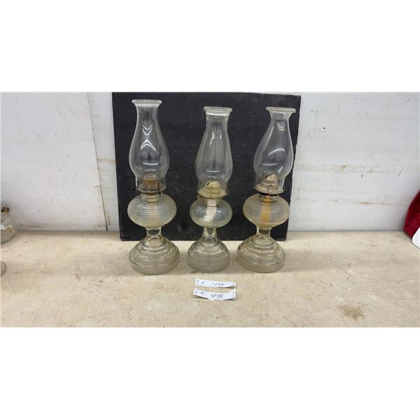 Three Antique Clear Glass Kerosene Oil Lamps With Ribbed Founts and Scroll Pedestal Bases