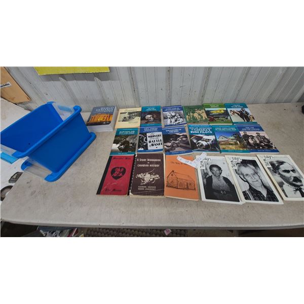Assorted Books and Blue Plastic Bin