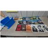 Image 1 : Assorted Books and Blue Plastic Bin