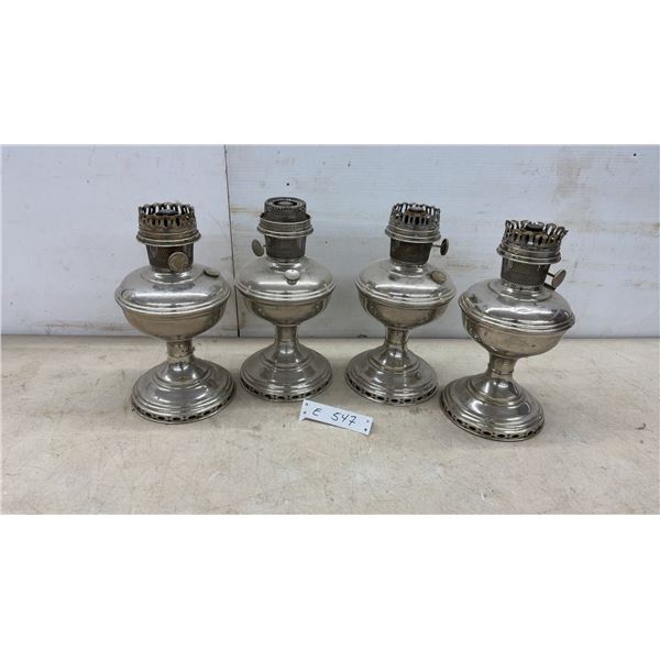 Four Antique Nickel-Plated Kerosene Aladdin Oil Lamps with Pierced Bases, No Chimneys