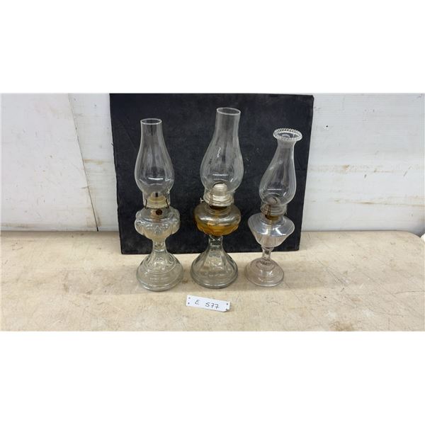 Three Clear Glass Oil Lamps with Pedestal Bases and Chimneys