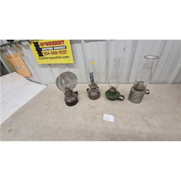 Four Oil Lamps: Wall-Mount Reflector Lamp, Wall-Mount Lamp, Green Base Lamp, and Metal Base Lamp