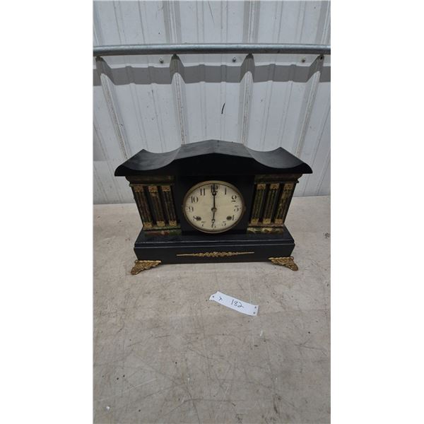 Antique Black Mantel Clock with Gilt Accents and Columns, Brass Feet
