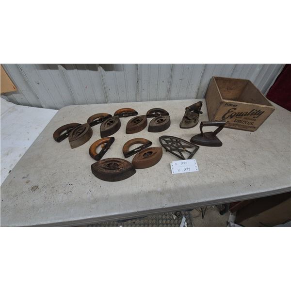 Collection of Antique Sad Irons, Trivets, and Equality Prune crate