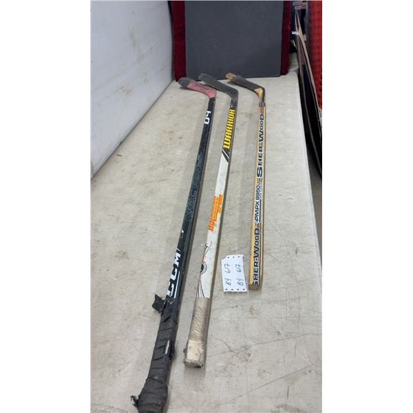 Three Hockey Sticks