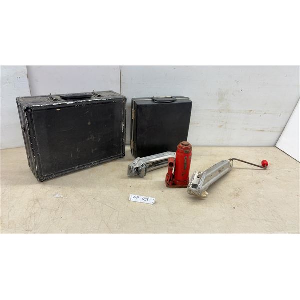 Two Cases, Red Hydraulic Jack, and Two Metal Hand Tools