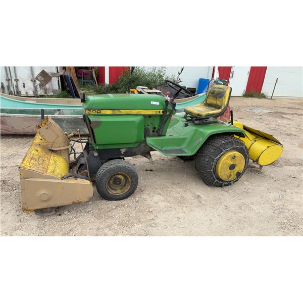 John Deere 300F Garden Tractor with Front Snow Blower, Rear Tiller, Tire Chains and Wheel Weights.