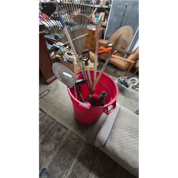 Assorted Garden Tools: Rakes, Shovels, Spades, and Brushes in Red Bucket