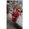Image 1 : Assorted Garden Tools: Rakes, Shovels, Spades, and Brushes in Red Bucket