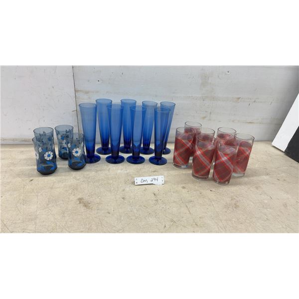 Vintage Glassware Set: Blue Floral Tumblers, Cobalt Pilsner Flutes, and Red Plaid Tumblers