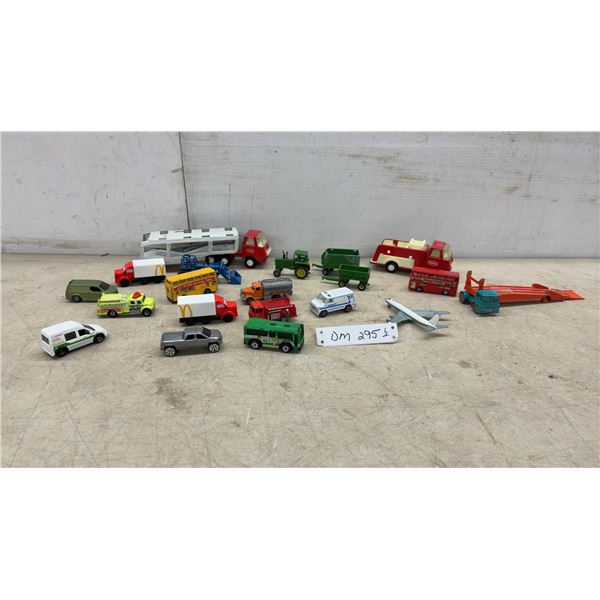 Tonka, Matchbox, Ertle and More Diecast Vehicles Including Fire Trucks, Buses, Tractor, and Car