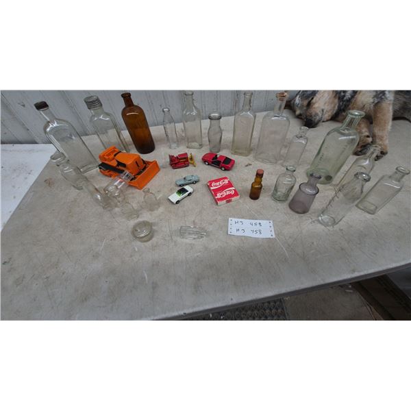Collection of Vintage Bottles and Toy Vehicles: Coca-Cola Package, Bulldozer
