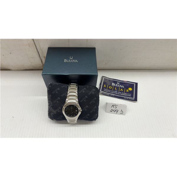 New Bulova Solar Stainless Steel Wristwatch with Dark Dial, Date Display, Box, and Owner's Guide