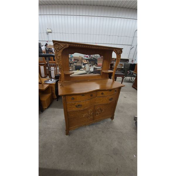 Oak Carved Sideboard with Mirror, Two Shelves, Four Drawers, and Two Cabinet Doors. 64”×48”×21”