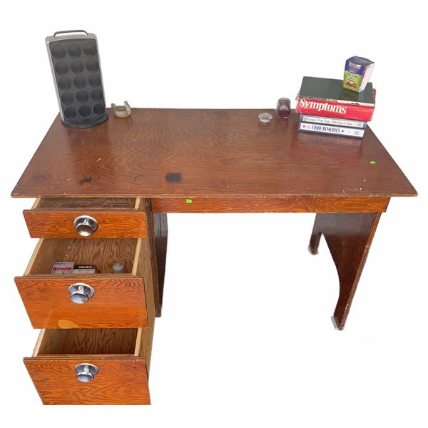 Desk With Three Drawers and Assorted Accessories