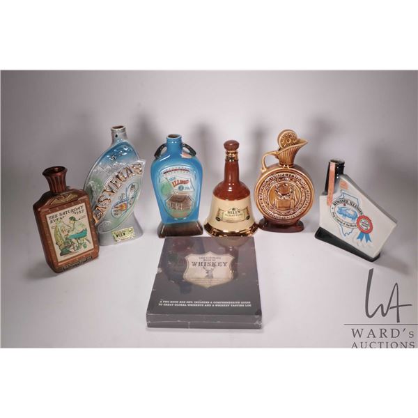 Two tray lots of collectible and branded drinking glass and two hardcover books including "The Ultim