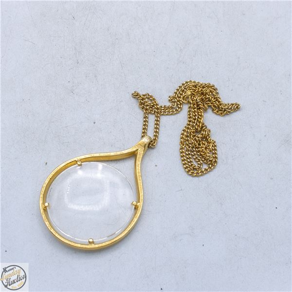 GOLD-TONE NECKLACE WITH LARGE MAGNIFYING GLASS