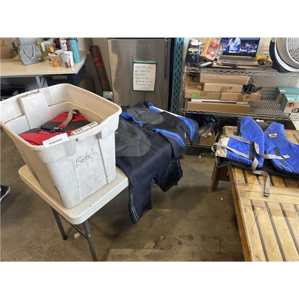 TOTE OF LIFE JACKETS AND WET SUITS