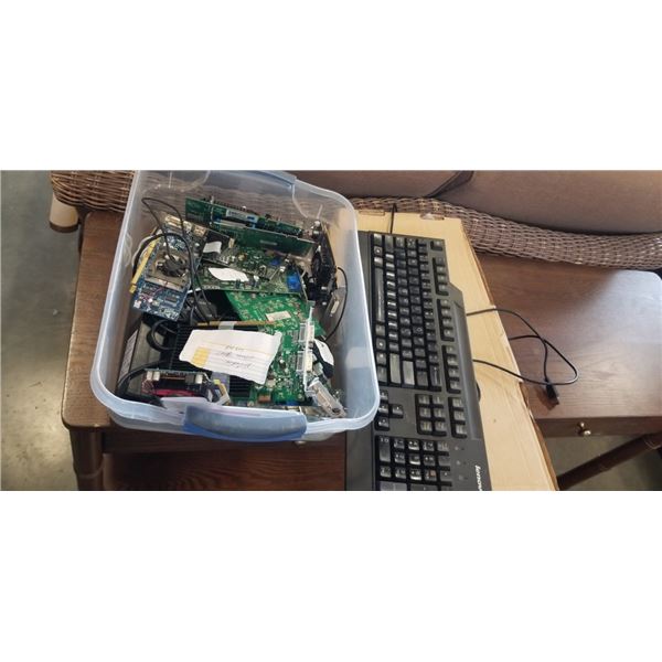 2 COMPUTER KEYBOARDS AND TRAY OF GRAPHICS CARDS