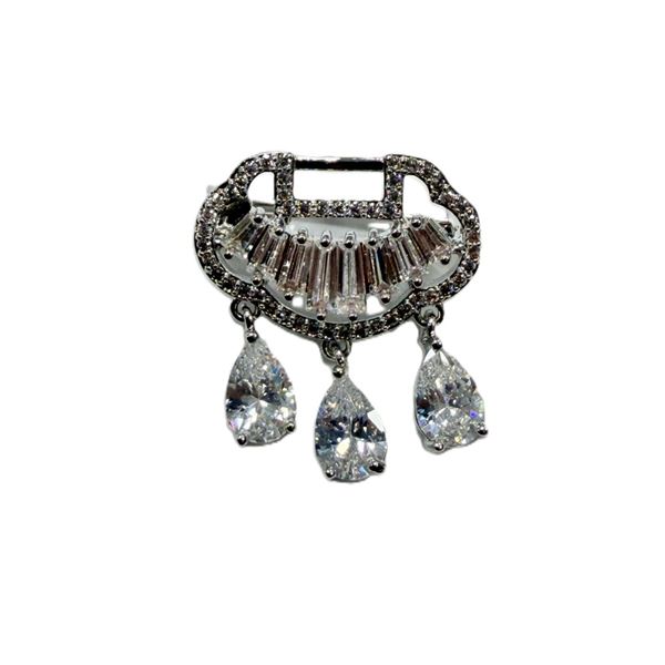PALLADIUM WHITE ELECTROPLATING BROOCH AND STONES ARE SYNTHETIC ZIRCONIA.