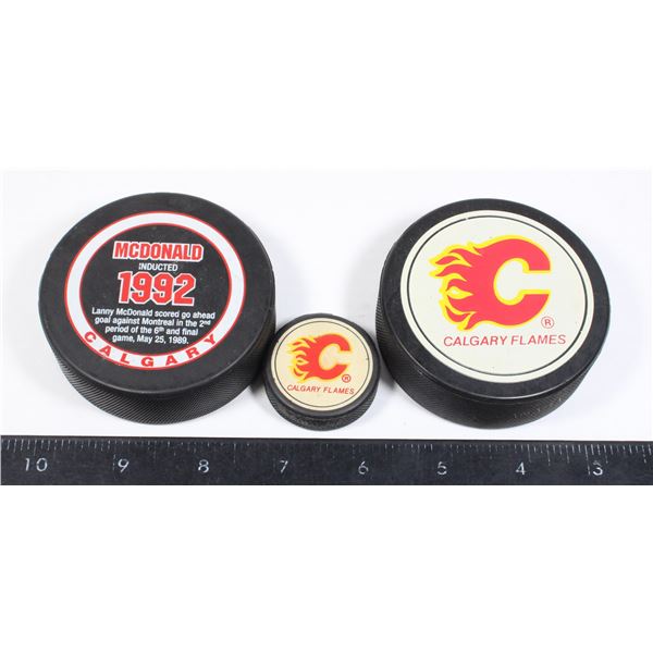 CALGARY FLAMES HOCKEY PUCKS AND MINI PUCK