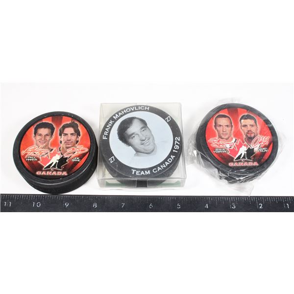 TEAM CANADA HOCKEY PUCKS, ONE SEALED