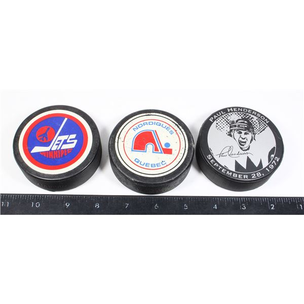 JETS, QUEBEC, PAUL HENDERSON HOCKEY PUCKS