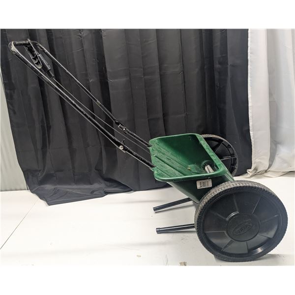 Grass seed/fertilizer spreader