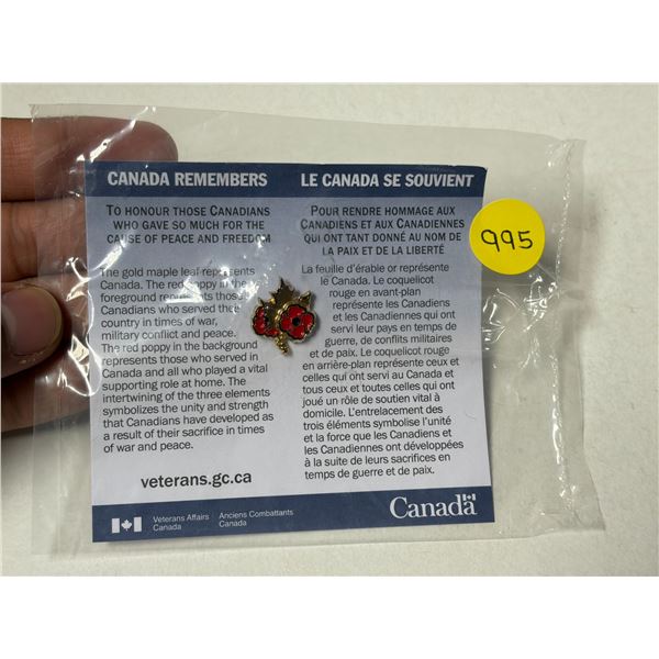 Canada Remembers Pin. Gold Maple Leaf and Red Poppies. Housed in its unopened original plastic packa