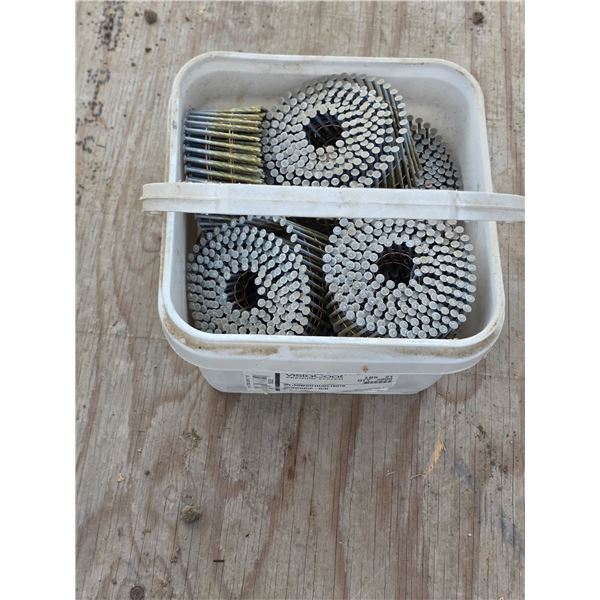 Pail of coiled roofing nails