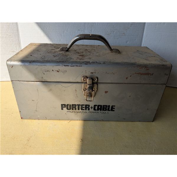 Vintage metal toolbox with assorted tools