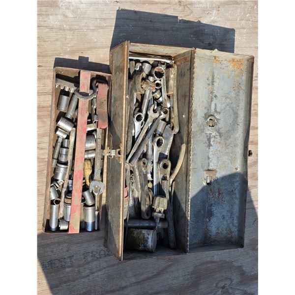 Tool box full of sockets and wrenches