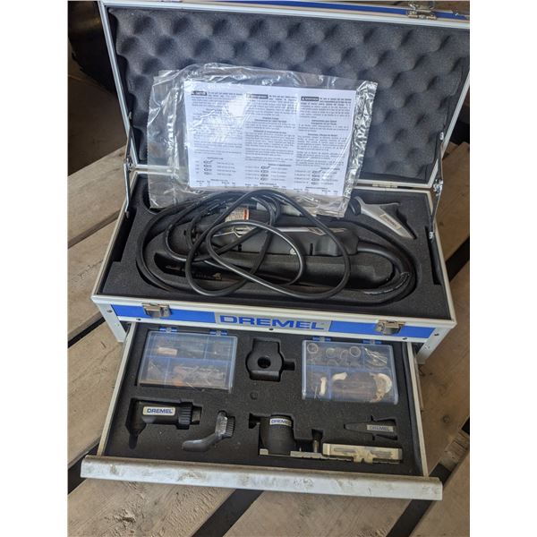 Dremel with attachments in storage case
