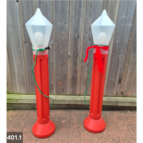 Pair of blow mold light-up outdoor candles. Approx. 39 inches tall, excellent condition