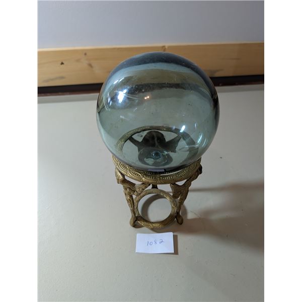 Glass fishing float and brass stand