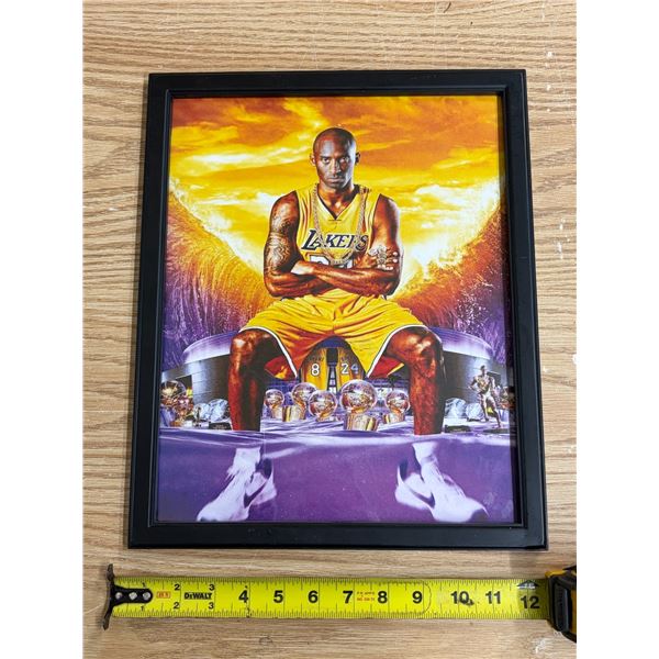 Framed art print of Los Angeles Lakers legend Kobe Bryant seated in a yellow jersey with championshi