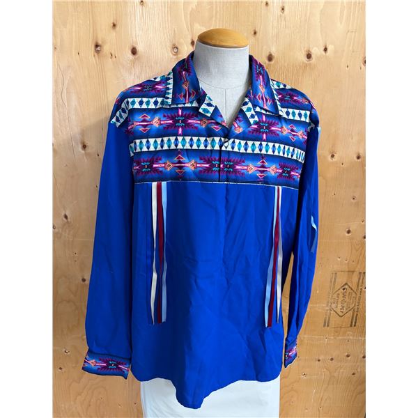 Traditional Indigenous ribbon shirt featuring a bright blue body, a geometric Aztec-style patterned 