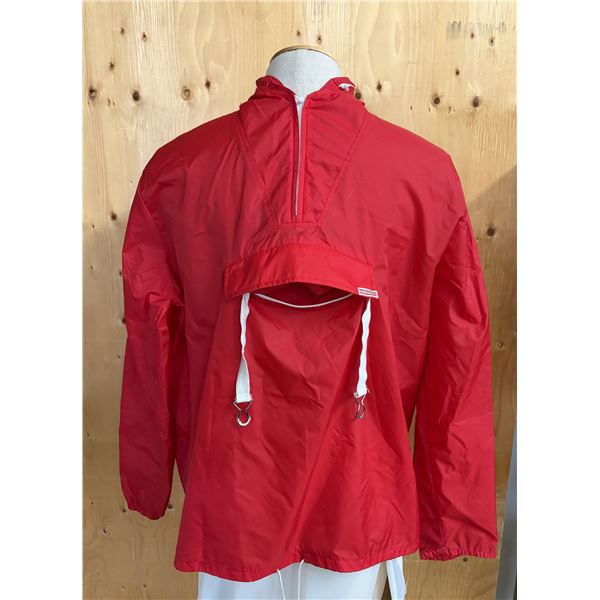 Vintage red half-zip windbreaker pullover featuring a prominent front pouch pocket with white drawst