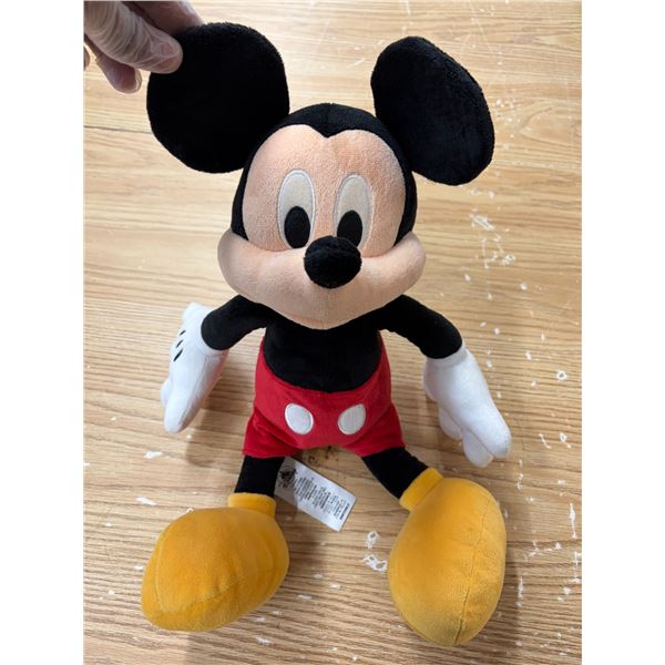 Authentic Disney Store Mickey Mouse plush toy featuring his classic red shorts, yellow shoes, and wh